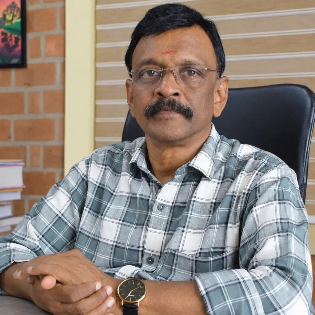 Portrait of Dr. K.R. Krishnakumar, Senior Homeopathic Physician